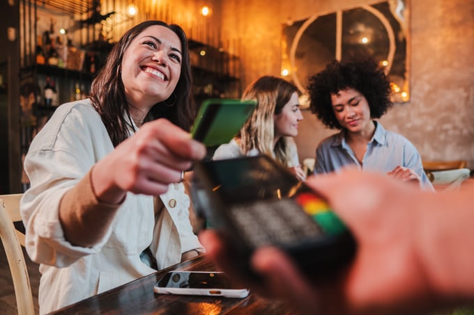 Friends or Couple Dining Out and Paying with a Credit Card